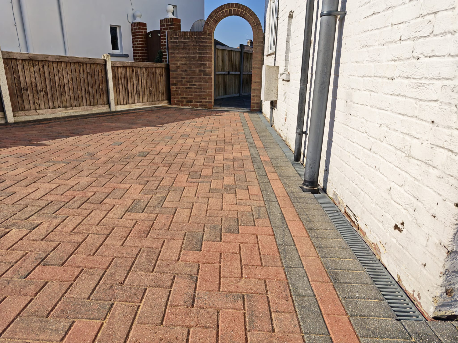 Clean block paving beside the property after treatment by OOR External